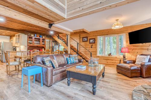 a living room with a couch and a table at Riverside Sanctuary in Rhododendron
