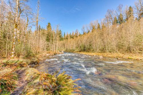 a river in the middle of a forest at Riverside Sanctuary in Rhododendron