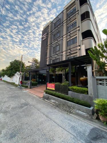 a large building on the side of a street at bangkok bed place in Bangkok