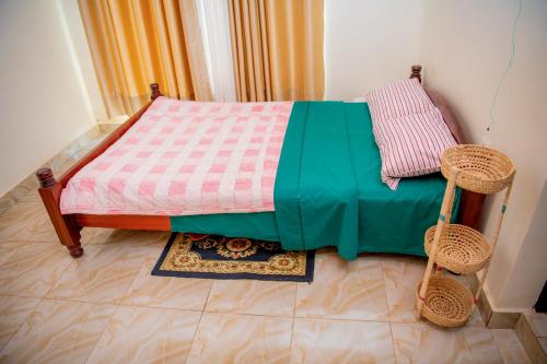 A bed or beds in a room at Nazareth Guest House