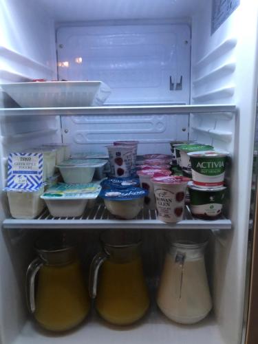 an open refrigerator filled with lots of food at Maridon House in Oban