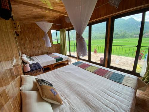 Ліжко або ліжка в номері Little Mai Chau Home Stay