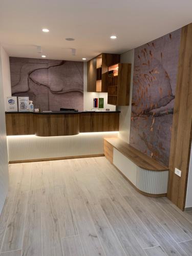 a lobby with a reception desk and wooden floors at Žigon Bed & Breakfast in Logatec
