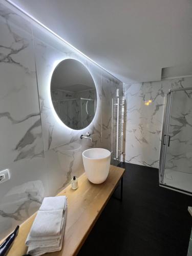 a bathroom with a sink and a mirror at Room Verona Ai Conti in Verona