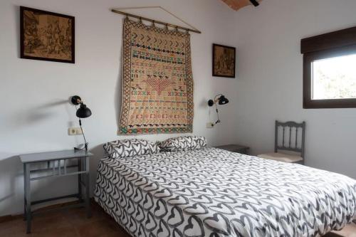 A bed or beds in a room at la Alhábega