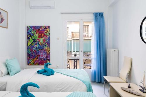 Koukaki Olympiou Apartment tesisinde bir odada yatak veya yataklar