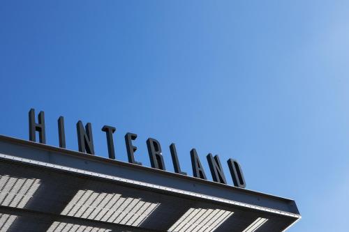 a sign on the side of a linkedin building at Nightcap at Hinterland Hotel Nerang in Gold Coast