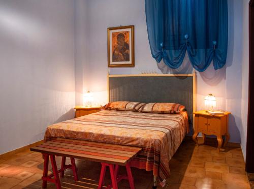 A bed or beds in a room at Casa Libertà