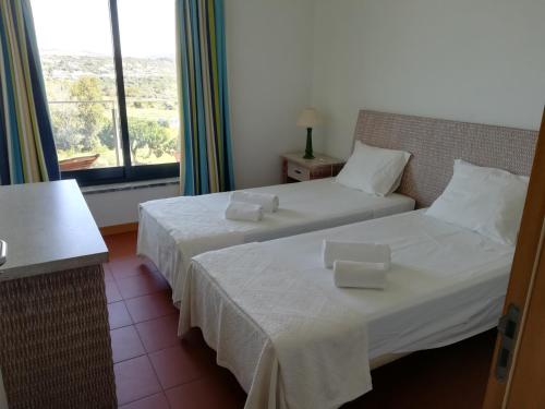 Postel nebo postele na pokoji v ubytování Residence Golf Club, Vilamoura