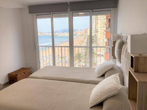 A bed or beds in a room at Happy stay