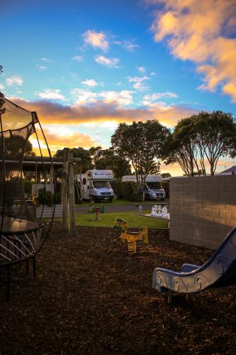 a park with a playground with a slide at New Plymouth TOP 10 Holiday Park in New Plymouth