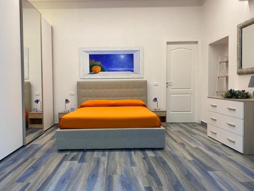 Tempat tidur dalam kamar di Appartamenti Acquazzurra