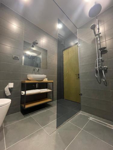 a bathroom with a sink and a shower at MIST Boutique Hotel in Yerevan
