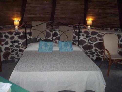 מיטה או מיטות בחדר ב-Ovile Juanne Loddo