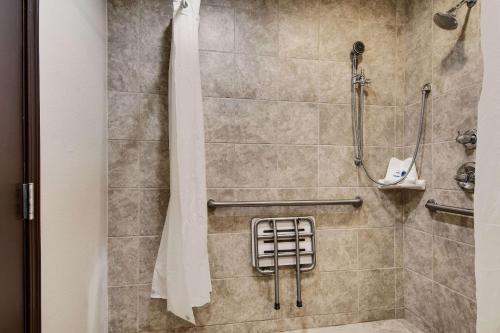 a shower stall in a hotel room at Rodeway Inn & Suites Portland - Jantzen Beach in Portland