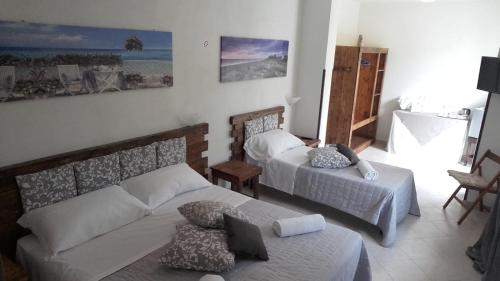 Posteľ alebo postele v izbe v ubytovaní Giulicia B&B