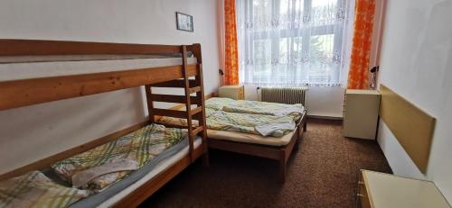 Postel nebo postele na pokoji v ubytování Penzion Heřmanice