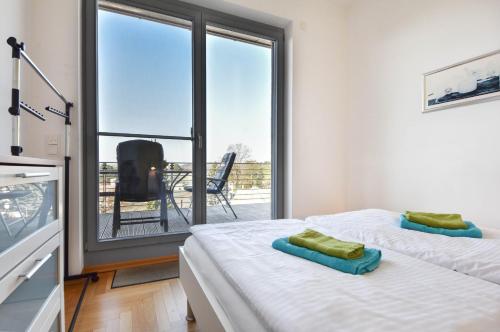 Ένα ή περισσότερα κρεβάτια σε δωμάτιο στο Penthouse West