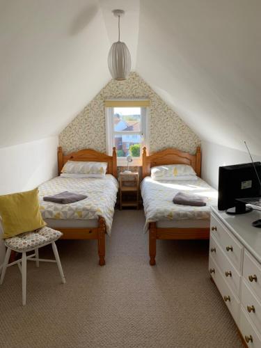 Llit o llits en una habitació de San Brelade