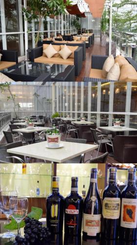 two pictures of wine bottles on a table in a restaurant at Apartemen MATARAM CITY YUDHISTIRA TOWER YOGYAKARTA in Kejayan