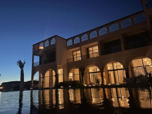a large building with water in front of it at kasbah yu palace in Ouarzazate