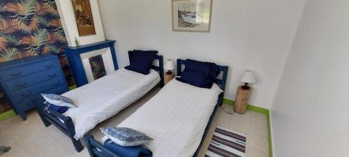Ένα ή περισσότερα κρεβάτια σε δωμάτιο στο Gîte d'Hybouville