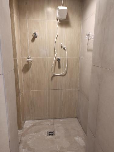 a shower with a shower head in a bathroom at Espaço aconchegante - Centro - São Paulo in Sao Paulo
