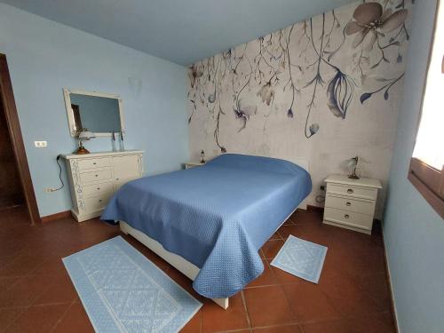 Ліжко або ліжка в номері "Sardinia Blue Home" Vista mare, tramonti mozzafiato su Golfo Asinara, giardino, parking e Wi-Fi