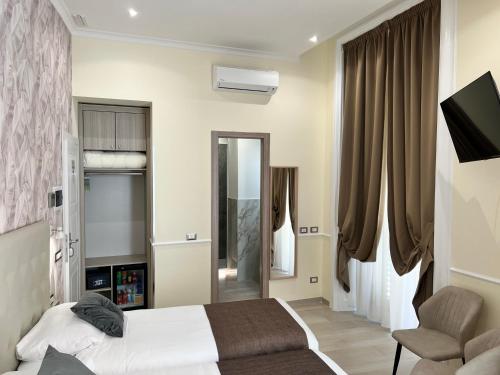 Телевизор и/или развлекательный центр в Hotel Le Petit