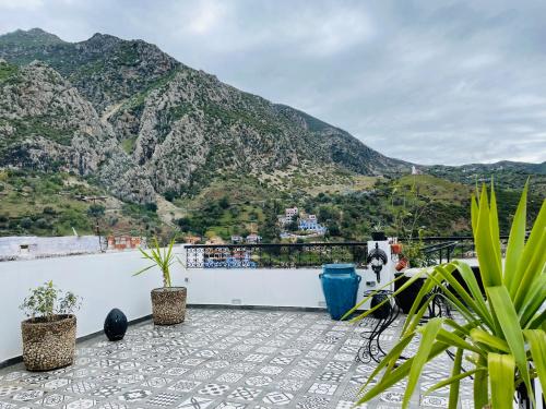 a balcony with a view of a mountain at Riad El Palacio & Spa Chaouen in Chefchaouene