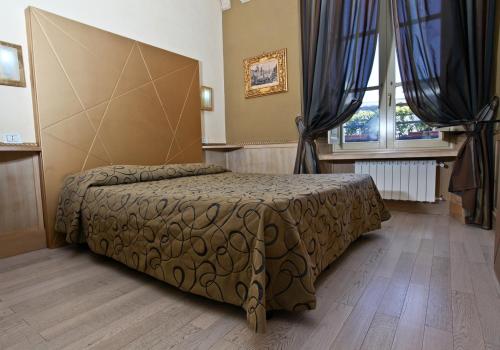 Voodi või voodid majutusasutuse Hotel Nardizzi Americana toas