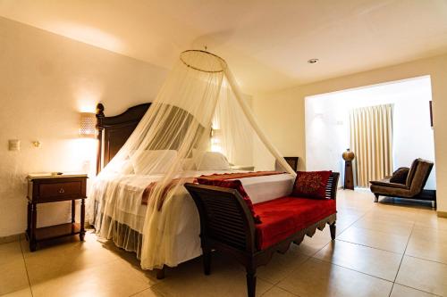 Una cama o camas en una habitación de Hotel María Jose