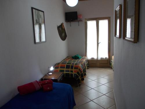 a room with two beds and a window at Soleli in Molino San Biagio