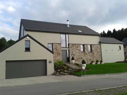 a large house with a garage at B&B Maison Pierreuse in Sart-lez-Spa