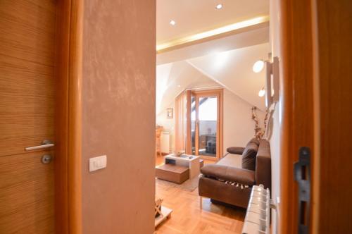 a living room with a couch and a table at Oaza in Zlatibor
