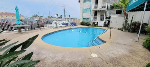 a swimming pool in the middle of a building at La Internacional 313 home in South Padre Island