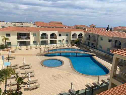 a view of a swimming pool in a resort at Great Kings Resort, Kapparis, Cyprus - Self Catering Apartment, Sleeps 6 in Paralimni