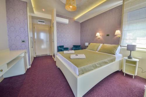 a bedroom with a large bed in a room at Villa Katarina in Budva