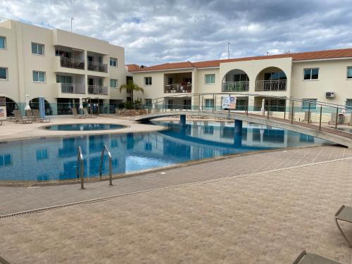 a large swimming pool in front of a building at Great Kings Resort, Kapparis, Cyprus - Self Catering Apartment, Sleeps 6 in Paralimni