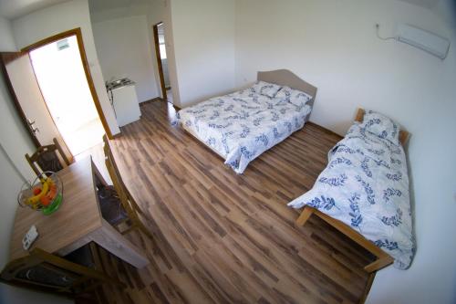 Postel nebo postele na pokoji v ubytování Apartmani Matej