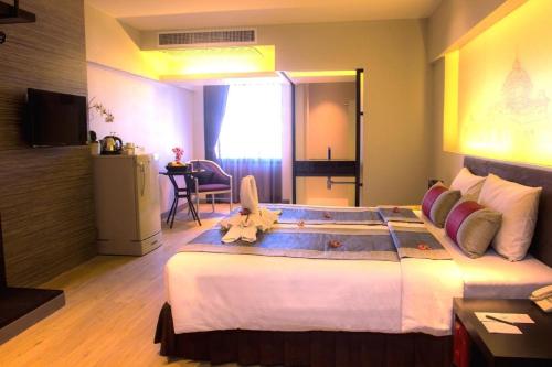 TV a/nebo společenská místnost v ubytování Nouvo City Hotel