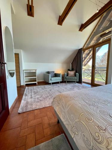 Katil atau katil-katil dalam bilik di Svencelė Resort
