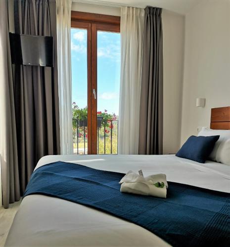 a bedroom with two beds and a window at LIRESCA in Lires