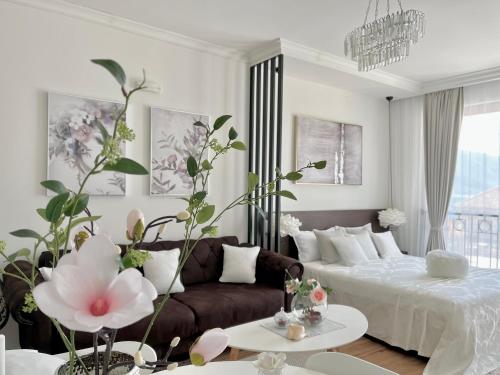 a living room with a bed and a couch at Vacanza, Sea view in Kotor