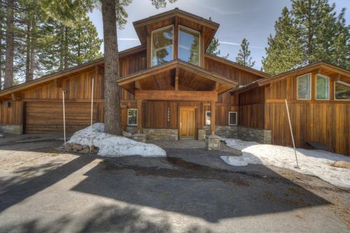 a large wooden house with a tree at Mountain & Lake-View Delight in Truckee