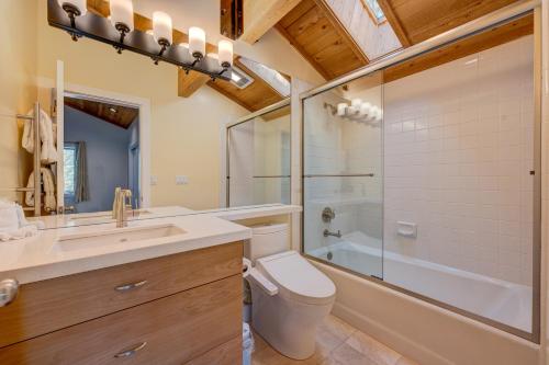 a bathroom with a toilet and a sink and a shower at Mountain & Lake-View Delight in Truckee
