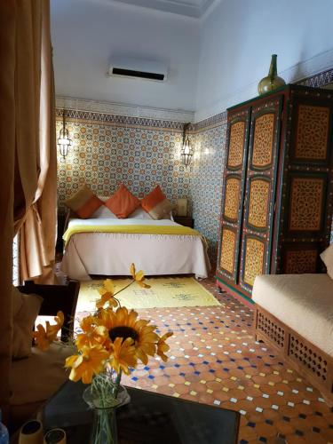 Ein Bett oder Betten in einem Zimmer der Unterkunft Riad Dar Zouhour