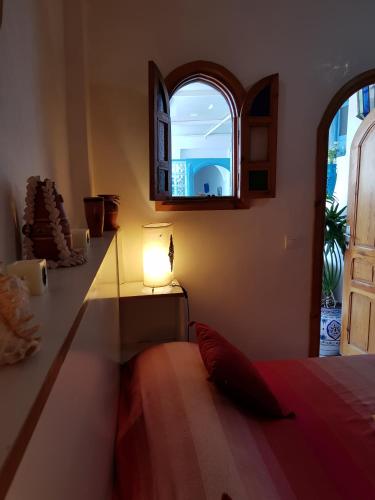 Ein Bett oder Betten in einem Zimmer der Unterkunft Riad Dar Zouhour