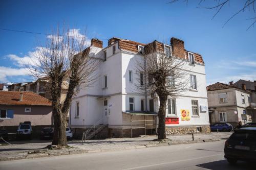 a white building on the side of a street at Darki Apartment - Bazaar Location With Free Parking in Ohrid