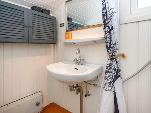 a bathroom with a sink and a mirror at 4 person holiday home in Hemmet-By Traum in Hemmet